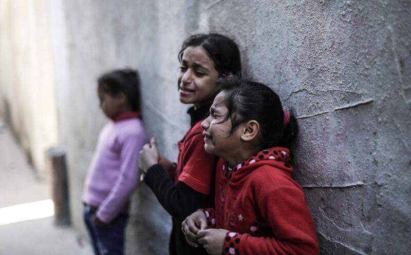 Girls mourn during a funeral in Nusseirat refugee camp in the central Gaza Strip. AFP
