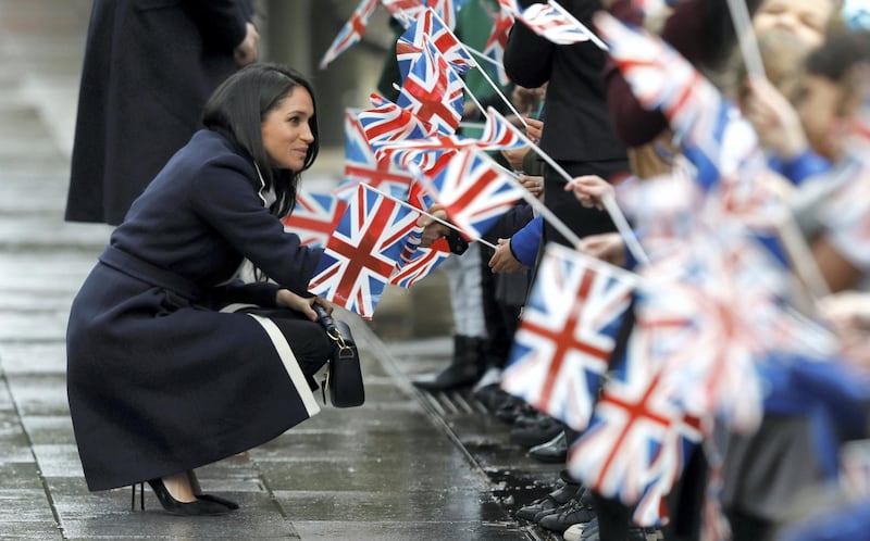 Meghan Markle meets local school children during a walkabout with Britain's Prince Harry during a visit to Birmingham, Britain, March 8, 2018. REUTERS/Phil Noble