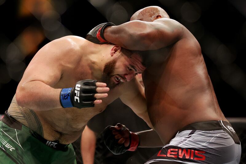 Tai Tuivasa and Derrick Lewis in their heavyweight fight at UFC 271. AFP