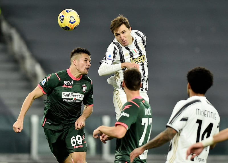 Juventus' Federico Chiesa heads the ball. Reuters