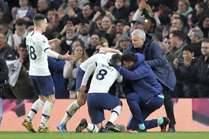 Tottenham Hotspur's South Korean striker Son Heung-Min celebrates with teammates and Tottenham Hotspur's Portuguese head coach Jose Mourinho (R) after scoring their second goal during the English Premier League football match between Tottenham Hotspur and Manchester City at Tottenham Hotspur Stadium in London, on February 2, 2020. (Photo by Ben STANSALL / AFP) / RESTRICTED TO EDITORIAL USE. No use with unauthorized audio, video, data, fixture lists, club/league logos or 'live' services. Online in-match use limited to 120 images. An additional 40 images may be used in extra time. No video emulation. Social media in-match use limited to 120 images. An additional 40 images may be used in extra time. No use in betting publications, games or single club/league/player publications. / 