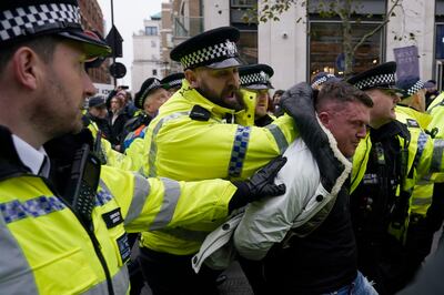 Far-right activist Tommy Robinson was arrested by police during the march.  AP Photo