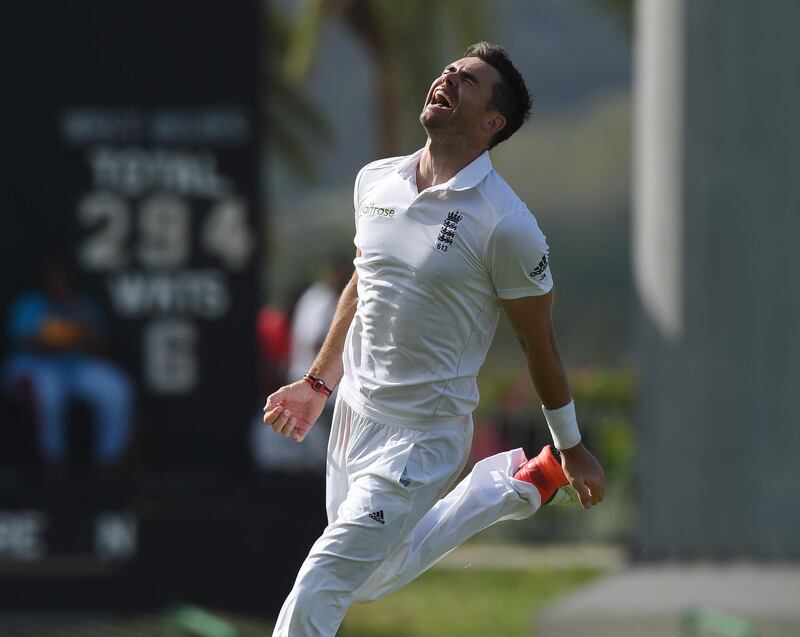 English fast bowler James Anderson celebrates after becoming the highest ever English wicket taker with 384 after taking the wicket of West Indies captain Denesh Ramdin on day five of the first cricket Test match between West Indies and England at the Sir Vivian Richards Stadium in St John's, Antigua on April 17, 2015.  Anderson has taken the record from previous holder Ian Botham on 383.         AFP PHOTO/ MARK RALSTON (Photo by MARK RALSTON / AFP)