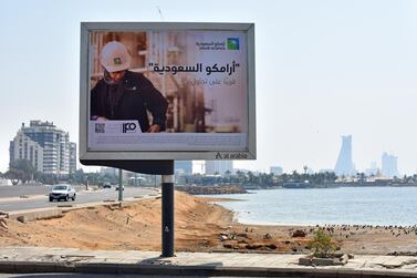 An advertisement advertising the planned Saudi Aramco initial public offering sits on display at the corniche coastline in Jeddah, Saudi Arabia. Bloomberg