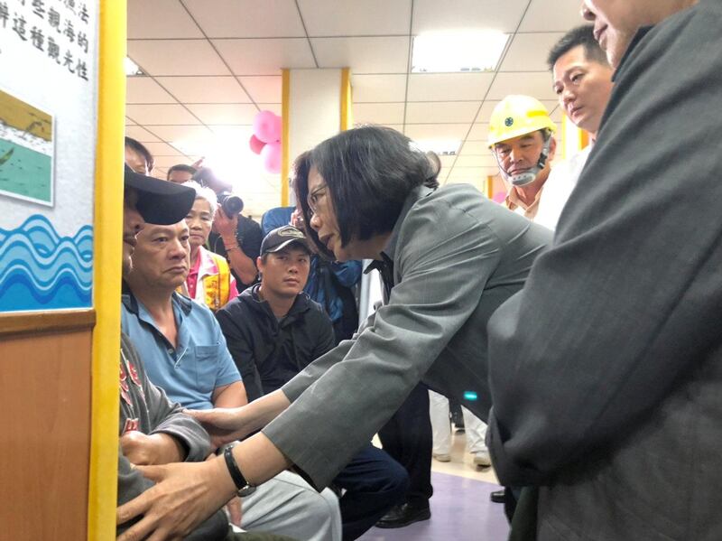 Taiwan's President Tsai Ing-wen visits family relatives of victims of train derailment, in Yilan, Taiwan. REUTERS