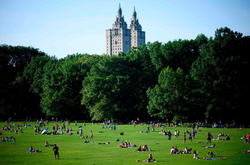 People enjoy the sun in Central Park in New York City, US. AFP