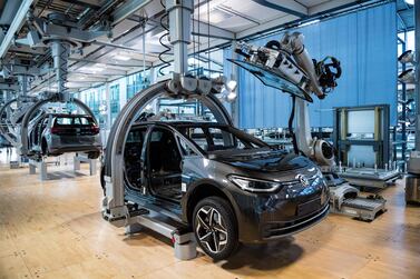 The body of a car is seen at a Volkswagen electric car assembly line in Dresden, Germany. AFP 