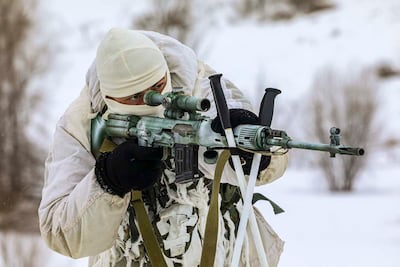 A sniper attends a military exercise in the Nizhny Novgorod Region, Russia.  AP Photo