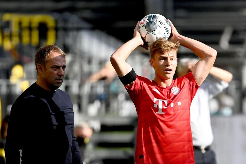 Bayern Munich's German midfielder Joshua Kimmich takes a throw in. AFP