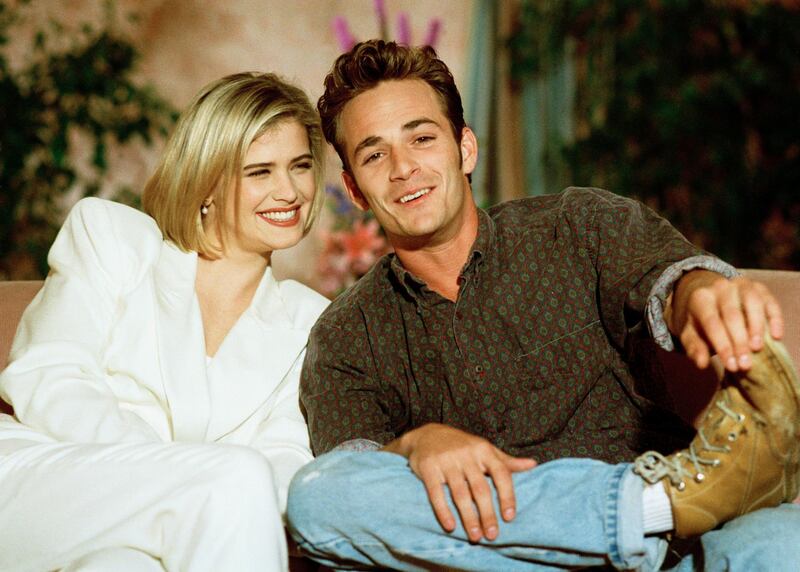 In this Aug. 3, 1992, photo, Kristy Swanson and Luke Perry, co-stars in the new film "Buffy the Vampire Slayer," talk about handling the hoopla of sudden fame during an interview in Los Angeles. Perry, who gained instant heartthrob status as wealthy rebel Dylan McKay on 'Beverly Hills, 90210,' died Monday, March 4. He was 52. Photo: AP