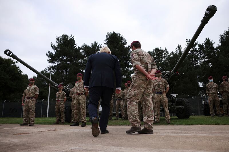 Britain's Prime Minister Boris Johnson, centre left, on a visit to Melville Barracks in Colchester, England where he met military personnel who worked on the Afghan evacuation. AP