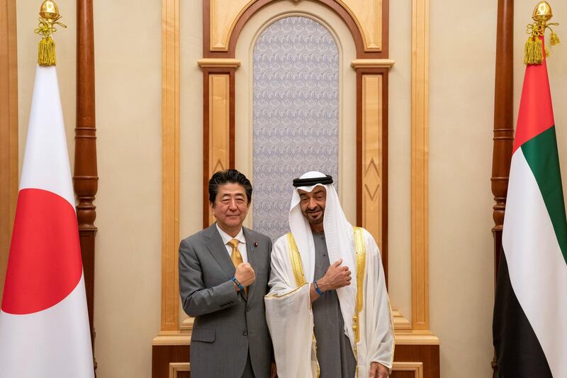 ABU DHABI, UNITED ARAB EMIRATES - January 13, 2020: HH Sheikh Mohamed bin Zayed Al Nahyan, Crown Prince of Abu Dhabi and Deputy Supreme Commander of the UAE Armed Forces (R) and HE Shinzo Abe, Prime Minister of Japan (L), stand for a photograph showing Expo 2020 bracelets, during a reception, at Qasr Al Watan.

( Hamad Al Kaabi / Ministry of Presidential Affairs )
---