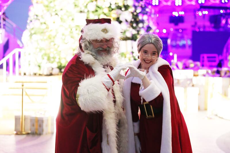 Santa and Mrs Claus attend the event at Al Wasl Plaza. Pawan Singh / The National