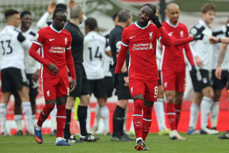 Liverpool's Guinean midfielder Naby Keita (centre right) reacts to their defeat on the final whistle in the English Premier League football match between Liverpool and Fulham at Anfield in Liverpool, north west England on March 7, 2021. - Fulham won the game 1-0. (Photo by Clive Brunskill / POOL / AFP) / RESTRICTED TO EDITORIAL USE. No use with unauthorized audio, video, data, fixture lists, club/league logos or 'live' services. Online in-match use limited to 120 images. An additional 40 images may be used in extra time. No video emulation. Social media in-match use limited to 120 images. An additional 40 images may be used in extra time. No use in betting publications, games or single club/league/player publications. / 