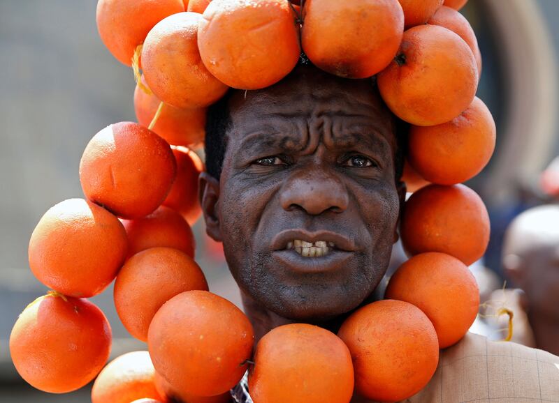 A supporter of the opposition National Super Alliance (NASA) wears oranges during a protest calling for the sacking of election board officials involved in August's cancelled presidential vote, in Nairobi, Kenya. Baz Ratner/ Reuters