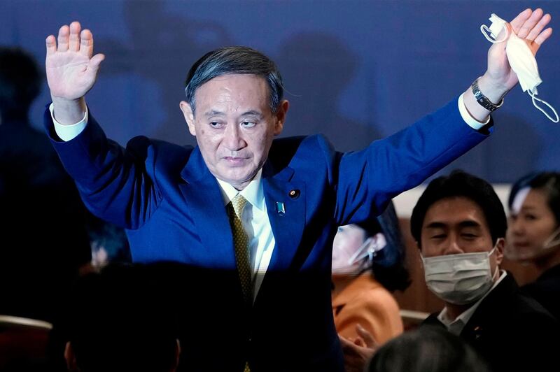 Japan's Chief Cabinet Secretary Yoshihide Suga reacts after being elected as new head of Japan’s ruling Liberal Democratic Party (LDP) at the party's leadership election in Tokyo on September 14, 2020. Japan's ruling party on September 14 elected chief cabinet secretary Yoshihide Suga as its new leader, making him all but certain to replace Shinzo Abe as the country's next prime minister. / AFP / POOL / Eugene Hoshiko
