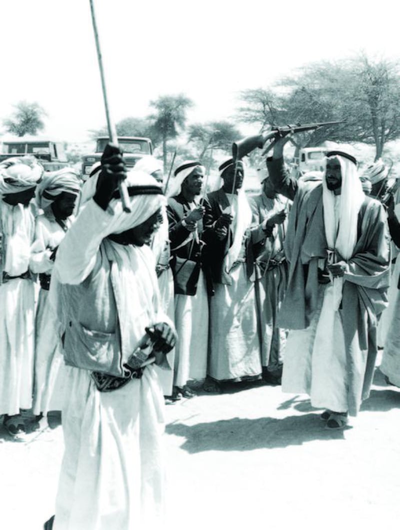 Traditional dancing in Al Ain after Ramadan, about 1960