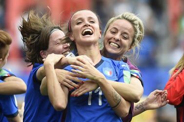 Italian players celebrate their victory at the end of the Group C match against Australia at the Hainaut Stadium in Valenciennes, northern France. AFP