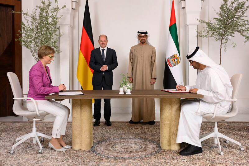 Sheikh Mohamed and Mr Scholz, witness the signing of a New Energy Security and Industry Accelerator agreement, by Dr Sultan Al Jaber, Minister of Industry and Advanced Technology Group, and Dr Franziska Brantner, Parliamentary State Secretary for Economic Affairs and Climate of Germany, at Al Shati Palace. Photo: UAE Presidential Court