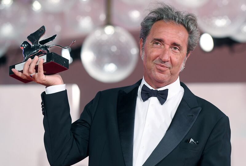 Italian director Paolo Sorrentino holds the Silver Lion Grand Jury Prize for his movie 'E stato la mano di Dio' (The Hand of God). EPA