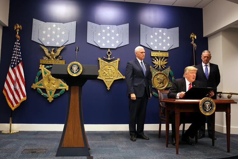US president Donald Trump signing an executive order to impose tighter vetting of travellers entering the United States, at the Pentagon in Washington, US on January 27, 2017. Carlos Barria/Reuters