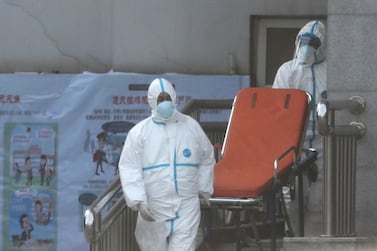 Medical staff transfer patients to Jinyintan hospital where patients infected with a new strain of Coronavirus identified as the cause of the Wuhan pneumonia outbreak are treated in Wuhan, Hubei province, China, January 20, 2020. EPA/STRINGER CHINA OUT