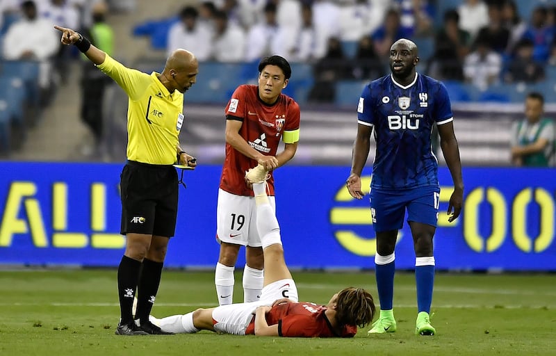 Atsuki Ito of Urawa lies on the pitch with a cramp during the Asian Champions League final. EPA