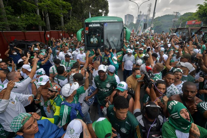 Supporters of Palmeiras surround a bus taking its players from the club's training centre to the airport in Sao Paulo. AFP