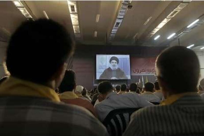 Hezbollah leader Sheik Hassan Nasrallah speaking on a screen during a ceremony marking the birth of one of Shiite Islam's most important saints. He called for the quick execution of Lebanese citizens sentenced to death for spying for Israel