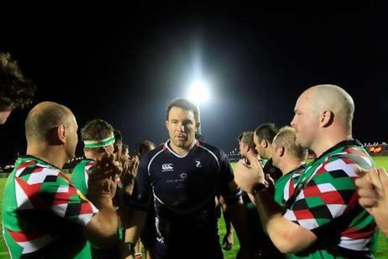 Paul Hart, centre, and the Jebel Ali Dragons have earned the respect of the Abu Dhabi Harlequins.