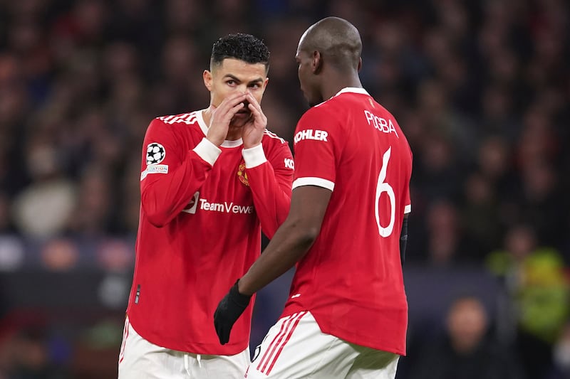 Manchester United's Cristiano Ronaldo, left, talks to teammate Paul Pogba during the Champions League defeat to Atletico Madrid at Old Trafford. AP