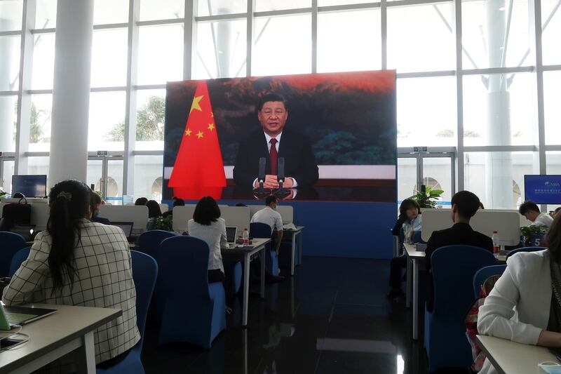 Chinese President Xi Jinping is seen on a giant screen at a media center, as he delivers via video link a keynote speech at the opening ceremony of the Boao Forum for Asia, in Boao, Hainan province, China April 20, 2021. REUTERS/Kevin Yao NO RESALES. NO ARCHIVES.