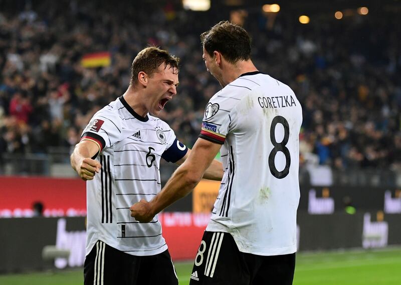 Germany's Joshua Kimmich celebrates with Leon Goretzka after Muller's winner. Reuters