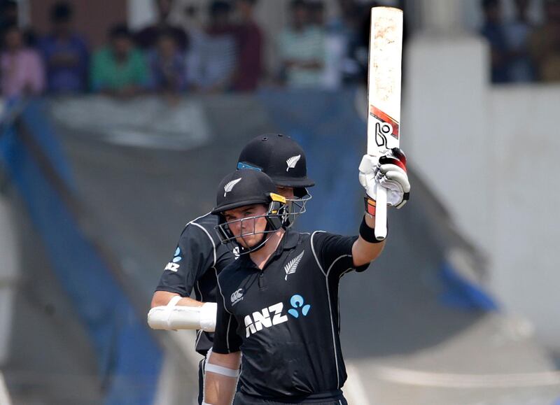 New Zealand's Tom Latham raises his bat after scoring century during a warm up cricket match against India A in Mumbai, India, Thursday, Oct. 19, 2017 . (AP Photo/Rafiq Maqbool)