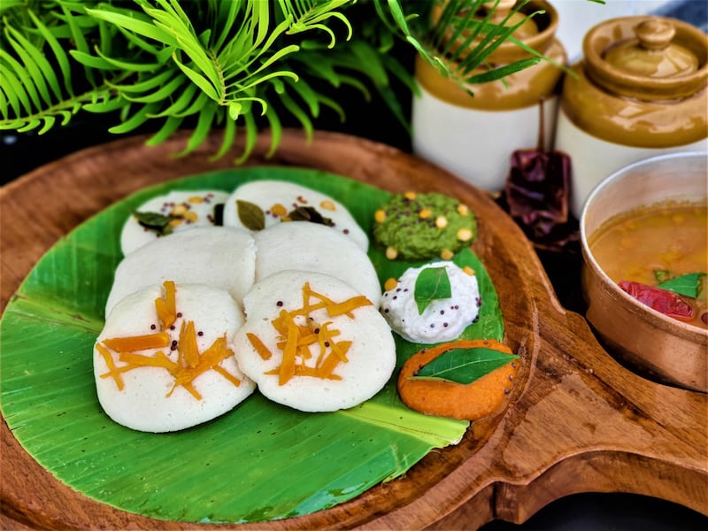 Idli is made from parboiled rice and black lentils, and served with colourful chutneys.