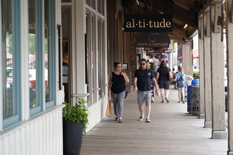 People walk past high-end shops in Jackson, Wyoming. Willy Lowry / The National