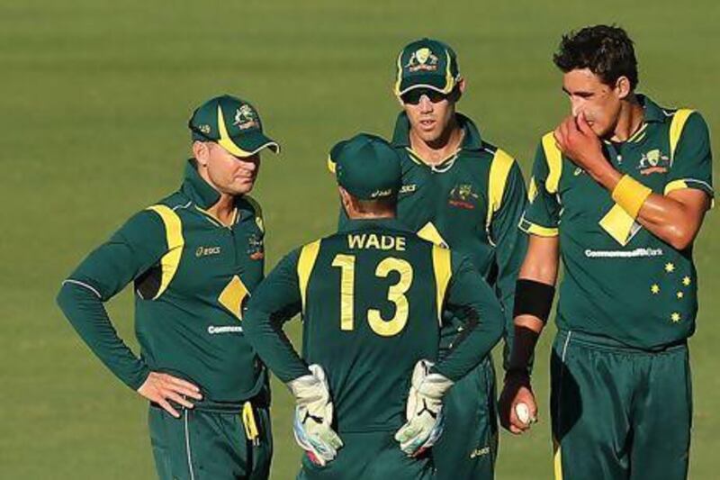 Michael Clarke, left, has an inexperienced team in Matthew Wade and Mitchell Starc, right. Paul Kane / Getty Images