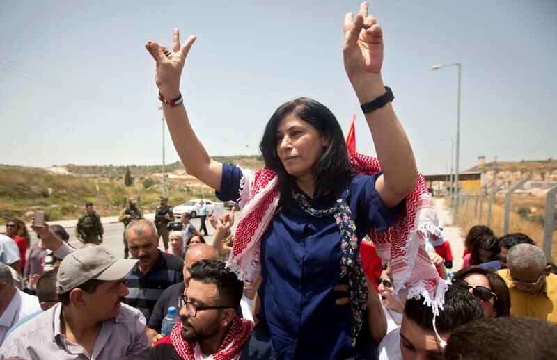 FILE - In this June 3, 2016 file photo, Palestinian lawmaker Khalida Jarrar is greeted by supporters after her release from an Israeli prison near the West Bank town of Tulkarem. The family of Jarrar said Thursday, Feb. 28, 2019, that Israeli authorities have released her after 20 months of holding her under "administrative detention," an Israeli policy that permits holding people for months at a time without charges. In 2015, she served 15 months after being convicted of incitement to violence and "promoting terror activities." (AP Photo/Majdi Mohammed, File)