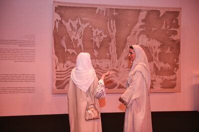 Visitors observe Adel Abidin's Ithra Art Prize-winning work. Photo: Ithra