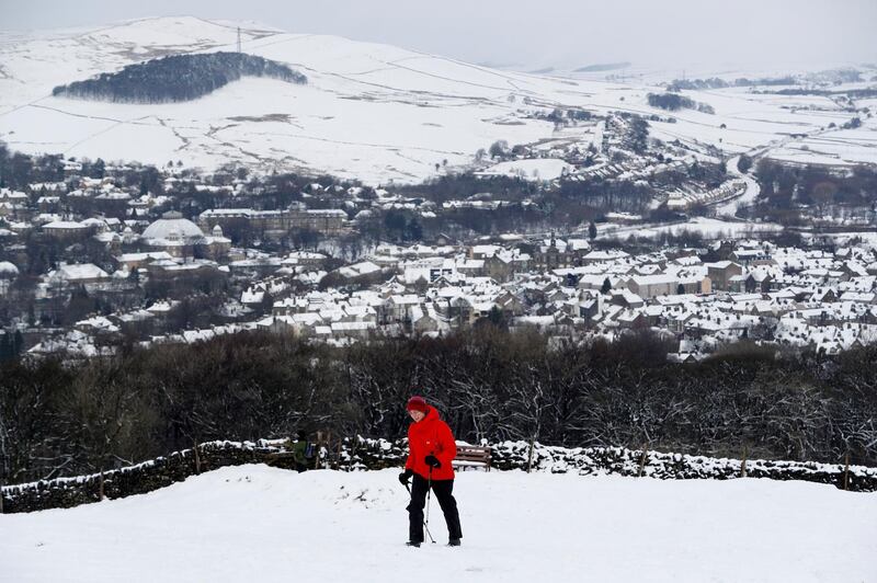 A walker treks towards Solomon's Temple after snow fall in Buxton. Darren Staples/ Reuters