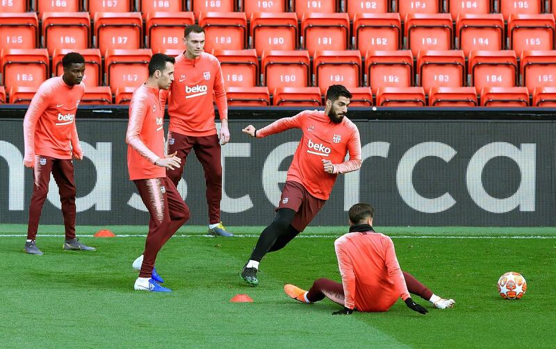 Luis Suarez and Barcelona teammates take part in training at Anfield ahead of the Uefa Champions League semi-final, second leg against Liverpool. AP Photo