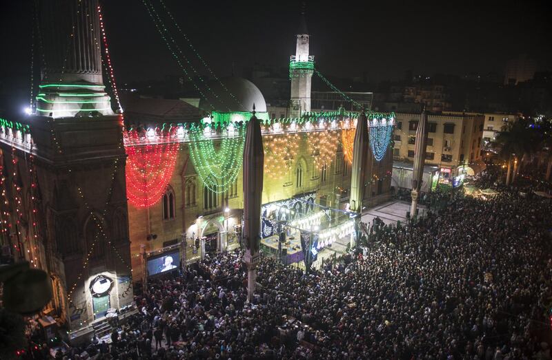 People celebrate at Cairo's Al-Hussein Mosque. EPA