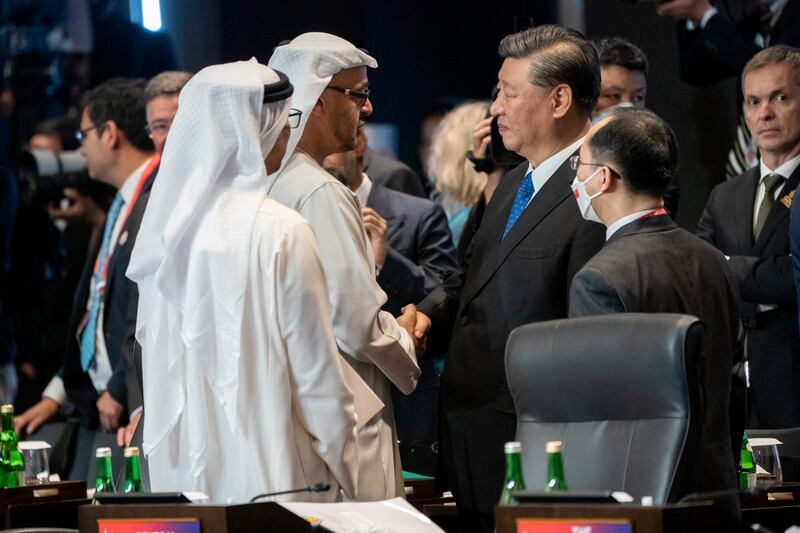 President Sheikh Mohamed talks to China's President Xi Jinping during the first session of the G20 summit in Bali, Indonesia. Photo: UAE Presidential Court 