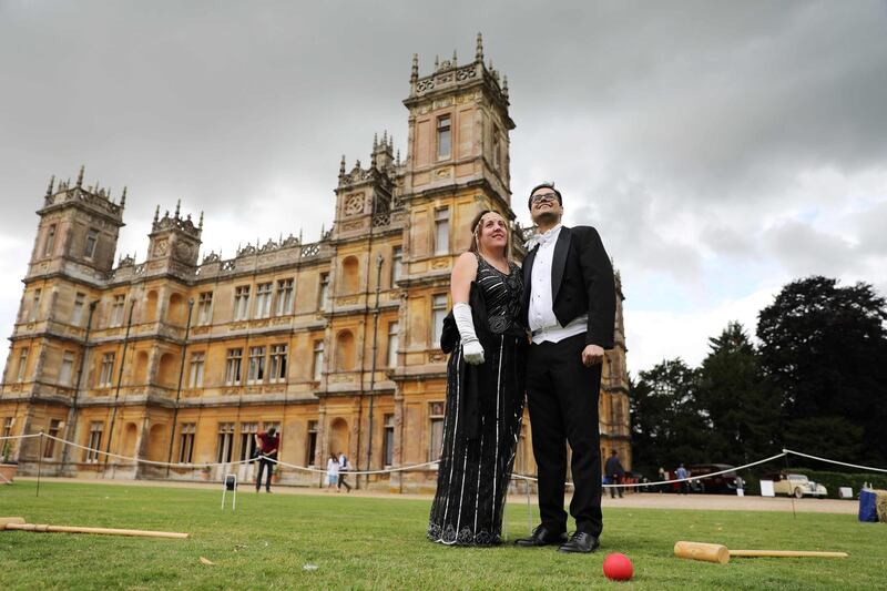 Visitors attend a 1920s themed event at Highclere Castle, near Newbury, west of London, on September 7, 2019, ahead of the world premiere of the Downton Abbey film. AFP