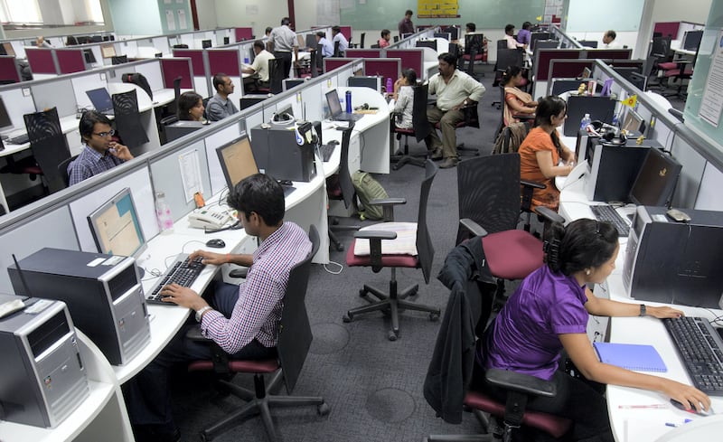 Workers are seen at their workstations on the floor of an outsourcing centre in Bangalore, February 29, 2012. India's IT industry, with Bangalore firms forming the largest component, is now worth an annual $100 billion and growing 14 percent per year, one of the few bright spots in an economy blighted by policy stagnation and political instability. Picture taken on February 29, 2012. To match Insight INDIA-OUTSOURCING/   REUTERS/Vivek Prakash (INDIA - Tags: BUSINESS EMPLOYMENT SCIENCE TECHNOLOGY) - GM1E8450SWY01