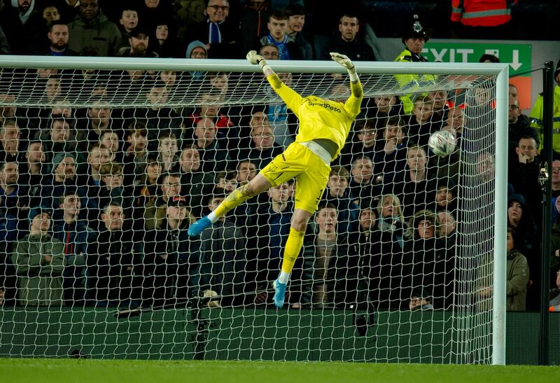 Everton's goalkeeper Jordan Pickford can't save Liverpool's Curtis Jones from scoring at Anfield. EPA