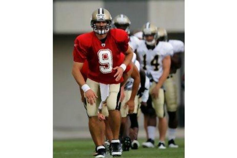 Drew Brees, in front, says it is time to 'hunker down' and stay focused amid 'the hoopla'.