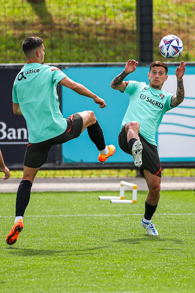 Andre Silva and Otavio battle for the ball during training. EPA