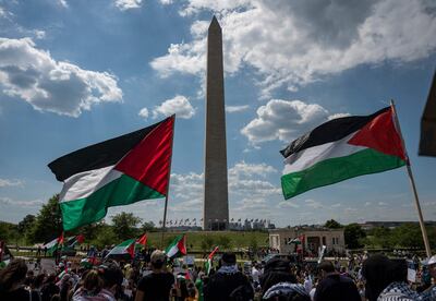 Activists and protesters march in support of Palestine near the Washington monument in Washington, DC on May 15, 2021. US President Joe Biden, in a phone call with Israeli Prime Minister Benjamin Netanyahu, expressed his "grave concern" Saturday over the flareup of violence in Israel and Gaza, the White House announced.
 / AFP / ANDREW CABALLERO-REYNOLDS
