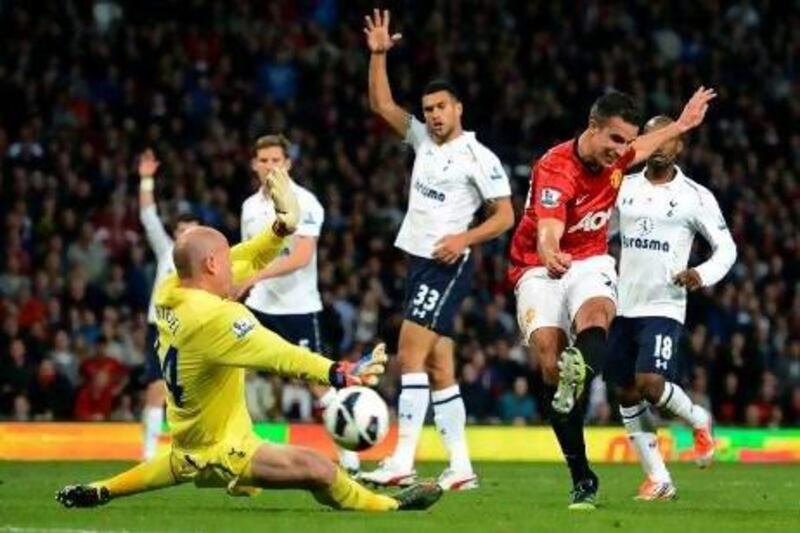 Manchester United's Robin van Persie tries to shoot past Tottenham Hotspur's Brad Friedel.